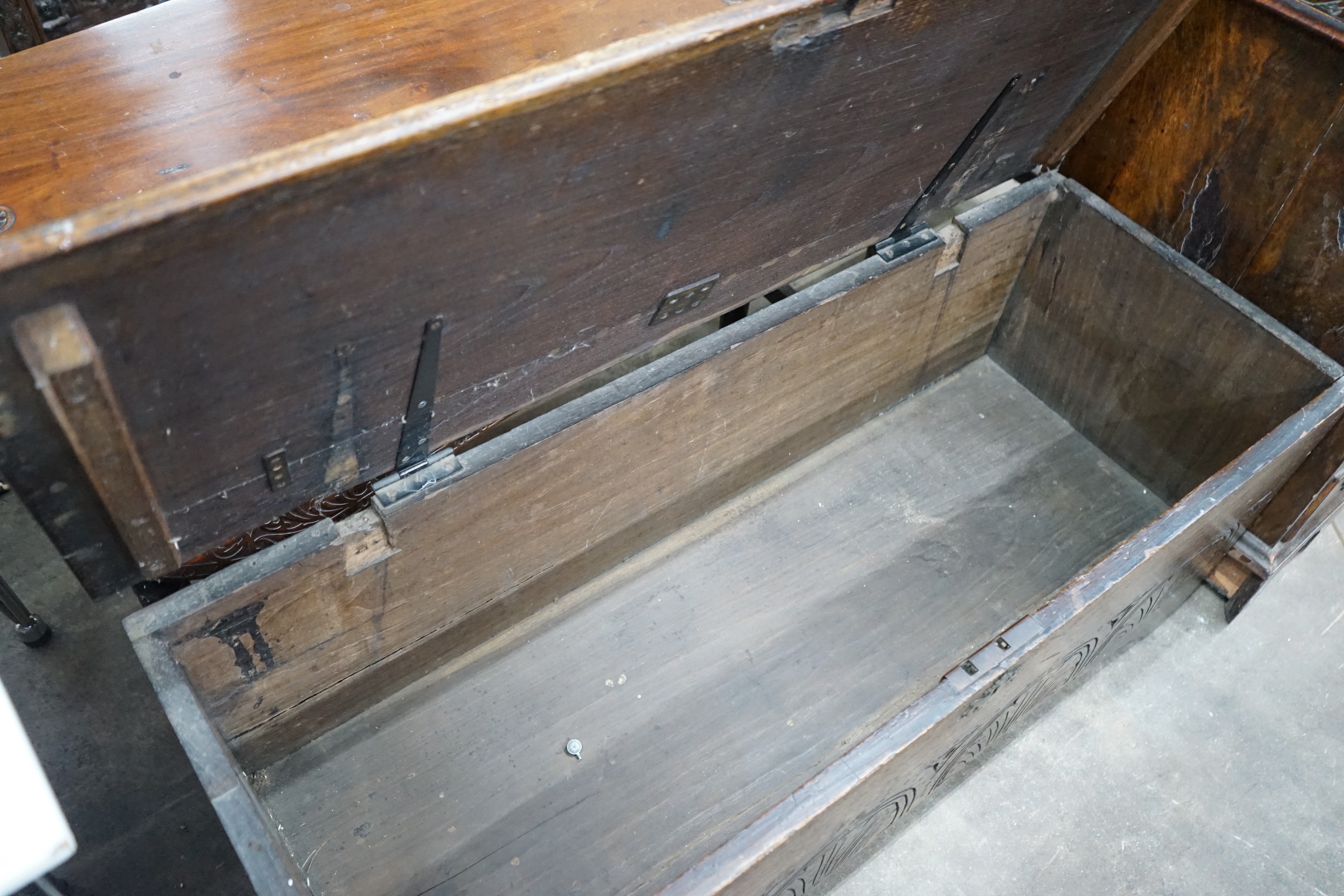 A late 17th / early 18th century carved six plank oak coffer width 115cms, depth 44cms, height 50cms.